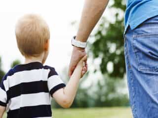 Parent walking with their child in Philly, PA